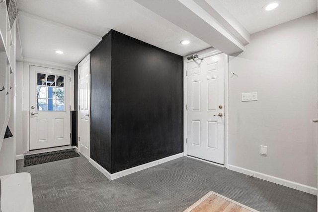 entryway with recessed lighting, baseboards, and carpet