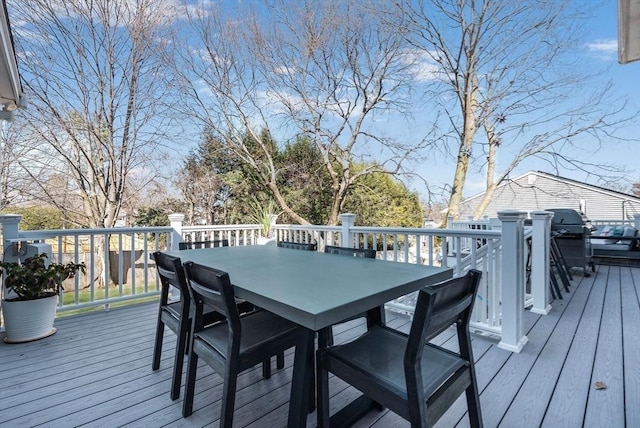 wooden terrace featuring outdoor dining space