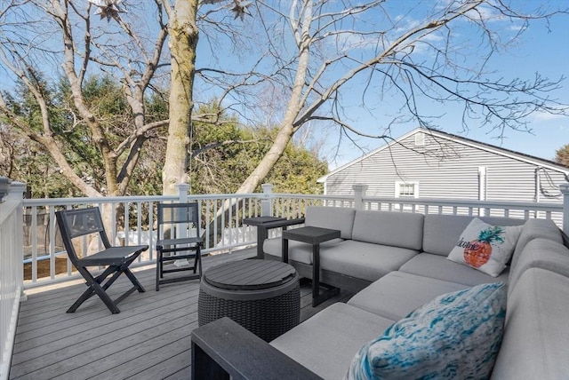 wooden terrace featuring an outdoor hangout area