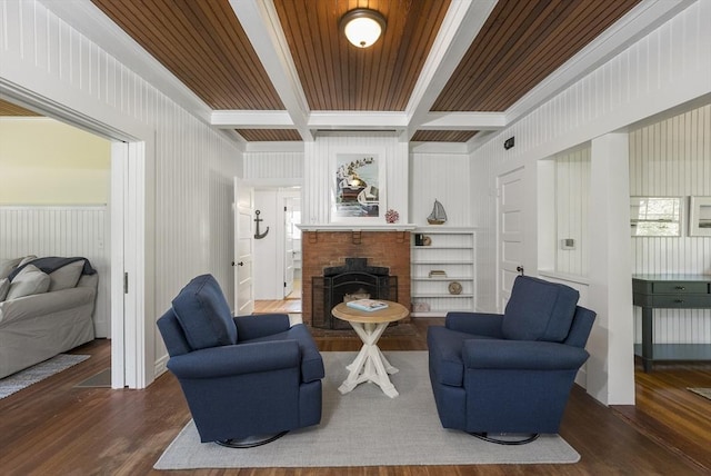 living room with dark wood-type flooring, built in shelves, and wooden ceiling