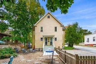 back of property with a fenced front yard