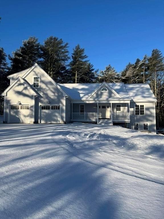 single story home with a garage and covered porch