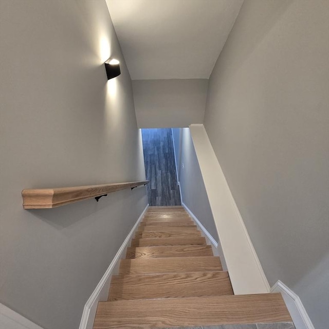 staircase featuring hardwood / wood-style floors