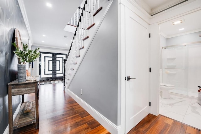 hall featuring dark hardwood / wood-style floors and crown molding