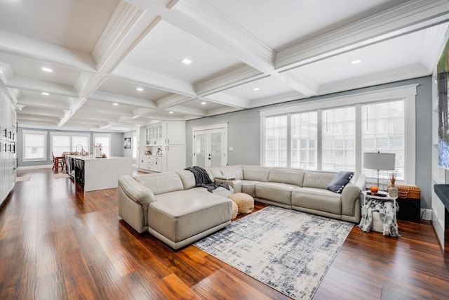 living room with dark wood-type flooring, beamed ceiling, and coffered ceiling