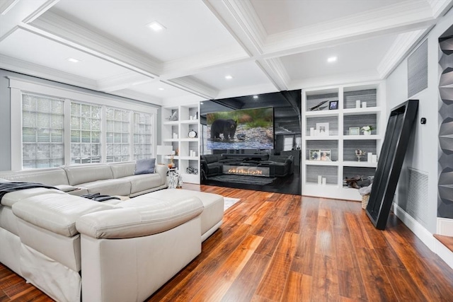 living room with hardwood / wood-style floors, coffered ceiling, a fireplace, built in features, and beamed ceiling