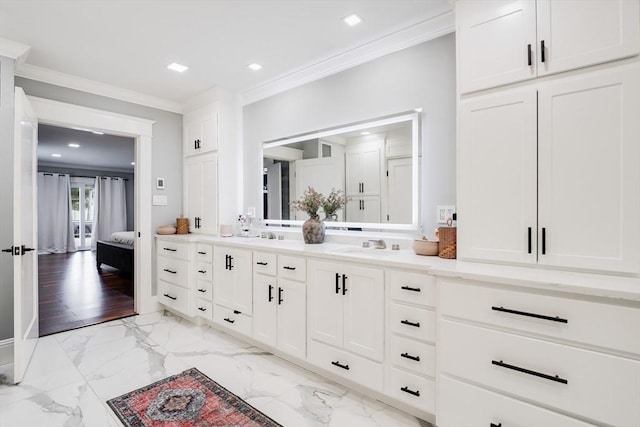 bathroom with vanity and ornamental molding