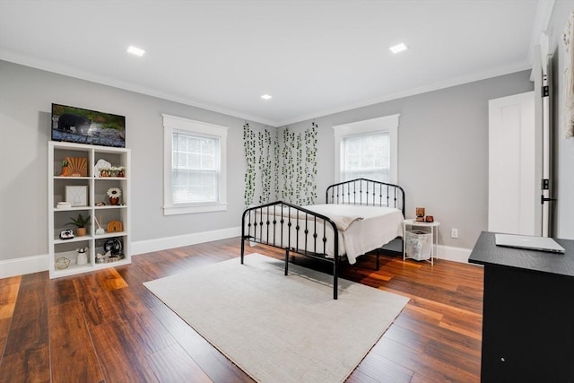 bedroom featuring dark hardwood / wood-style flooring and crown molding