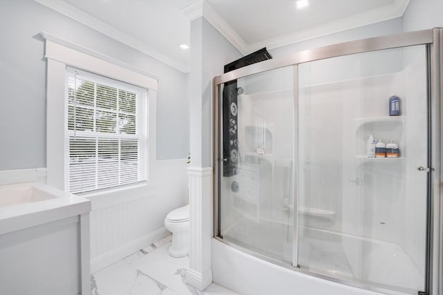 full bathroom featuring enclosed tub / shower combo, toilet, vanity, and crown molding