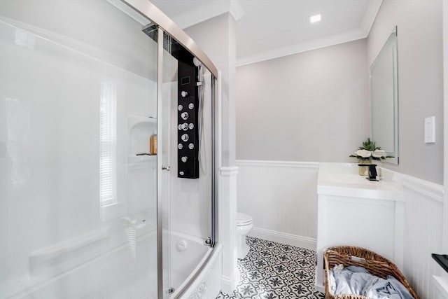 full bathroom featuring enclosed tub / shower combo, tile patterned floors, vanity, toilet, and ornamental molding