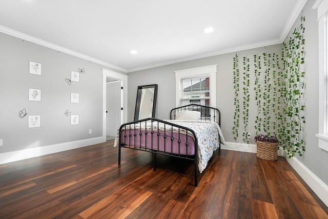 bedroom with ornamental molding and dark hardwood / wood-style flooring