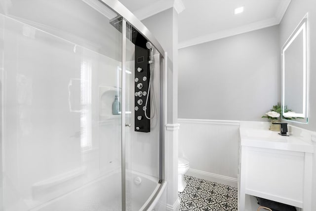 full bathroom featuring toilet, enclosed tub / shower combo, tile patterned floors, crown molding, and vanity