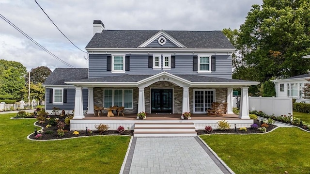 view of front of home with a front lawn and a porch