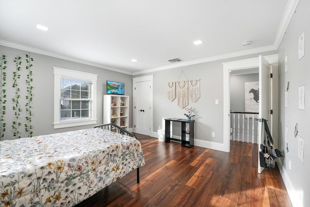 bedroom featuring dark wood-type flooring and ornamental molding