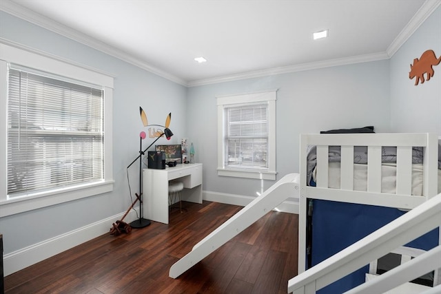 bedroom featuring dark hardwood / wood-style floors, multiple windows, and ornamental molding