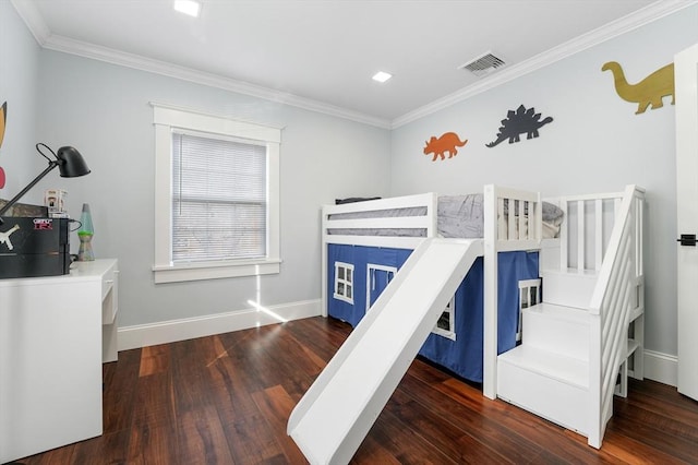 bedroom featuring dark hardwood / wood-style floors and crown molding