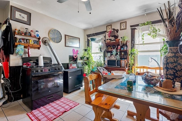 dining room featuring a ceiling fan and light tile patterned flooring