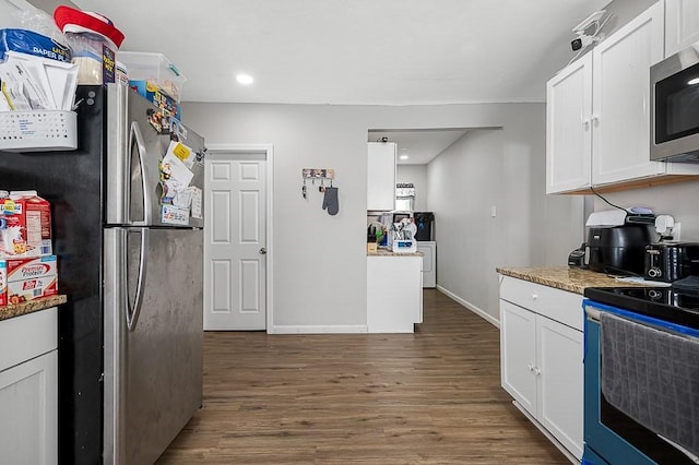 kitchen with stainless steel appliances, dark wood finished floors, white cabinets, baseboards, and recessed lighting