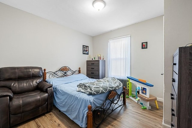 bedroom with wood finished floors
