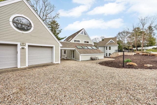 exterior space featuring an attached garage and driveway