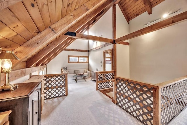 bonus room with wooden ceiling, vaulted ceiling with beams, and carpet