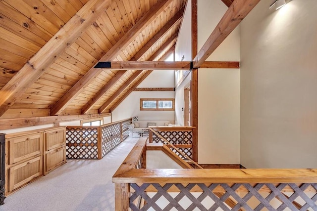 bonus room featuring wood ceiling, light colored carpet, and lofted ceiling with beams