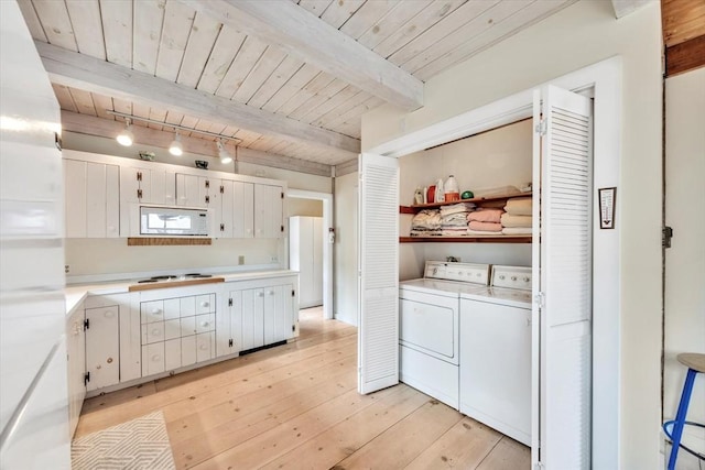 kitchen with wood ceiling, light countertops, white appliances, and washing machine and dryer