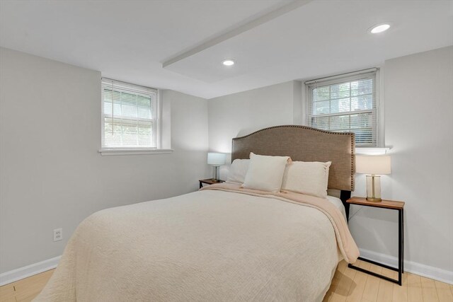 10 Shepard St Unit 2, Cambridge, MA 02139 - bedroom with baseboards, wood finished floors, multiple windows, and recessed lighting