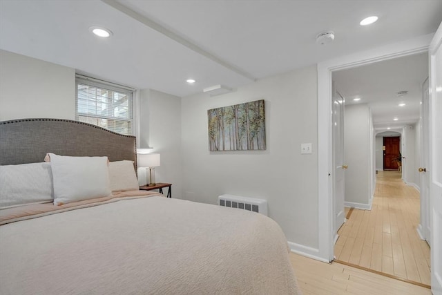 10 Shepard St Unit 2, Cambridge, MA 02139 - bedroom featuring light wood finished floors, recessed lighting, baseboards, and arched walkways