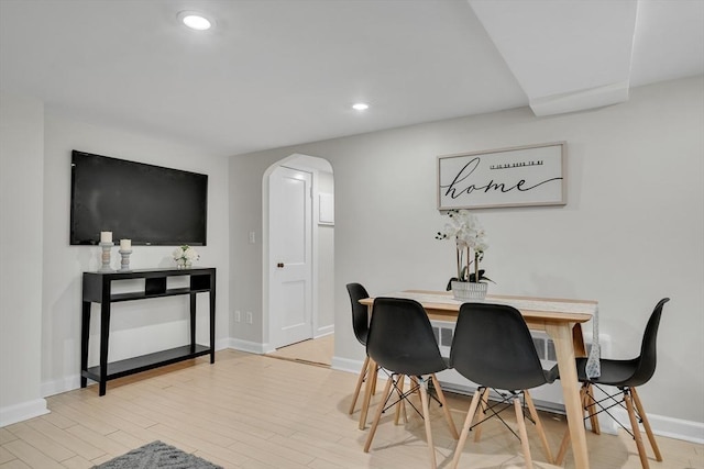10 Shepard St Unit 2, Cambridge, MA 02139 - dining room featuring arched walkways, wood finished floors, baseboards, and recessed lighting