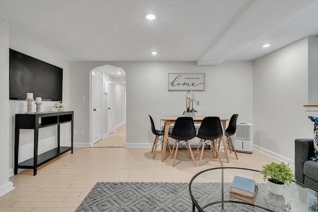 10 Shepard St Unit 2, Cambridge, MA 02139 - dining area featuring arched walkways, light wood finished floors, recessed lighting, and baseboards