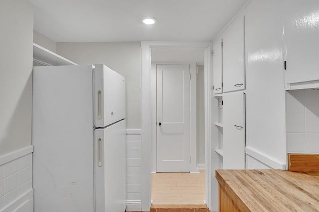 10 Shepard St Unit 2, Cambridge, MA 02139 - kitchen featuring freestanding refrigerator, white cabinetry, wooden counters, light wood-style flooring, and recessed lighting