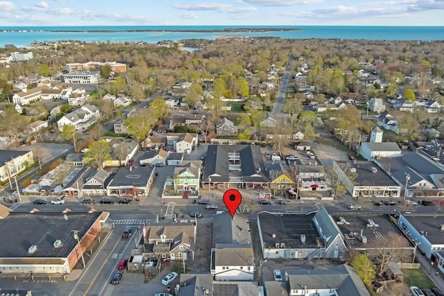 birds eye view of property with a residential view and a water view