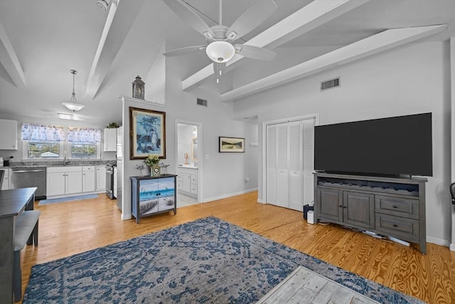 living room with baseboards, a ceiling fan, light wood-style flooring, and visible vents