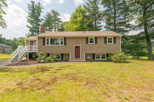 12 Pine St, Pepperell, MA 01463 - bi-level home featuring a chimney, a front yard, and stairway
