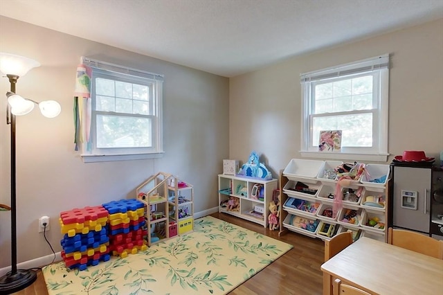 12 Pine St, Pepperell, MA 01463 - game room featuring wood finished floors and baseboards