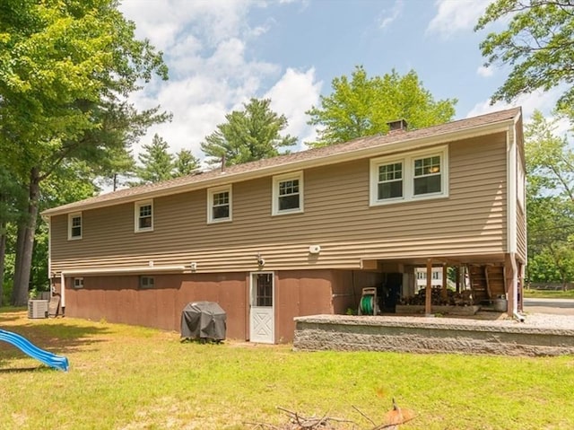 12 Pine St, Pepperell, MA 01463 - rear view of property with a lawn