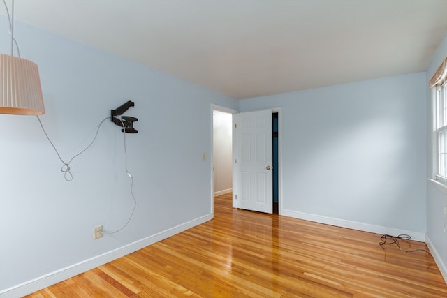 empty room with hardwood / wood-style floors