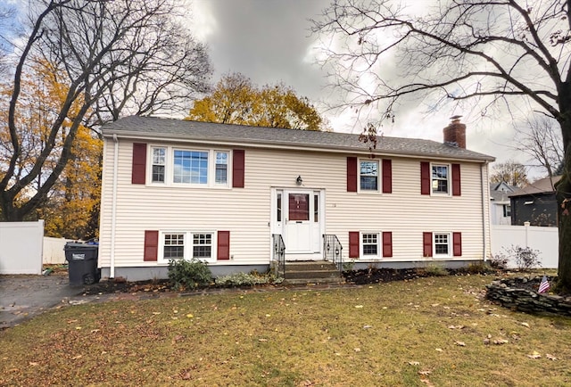 bi-level home with a front yard