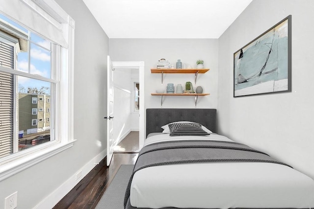 bedroom featuring dark wood-type flooring