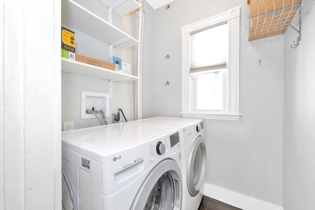 laundry area with washing machine and clothes dryer