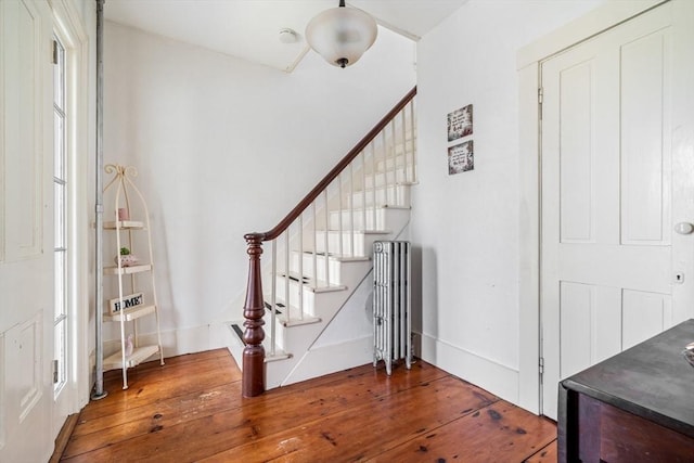 400 N Woodstock Rd, Southbridge, MA 01550 - foyer entrance featuring radiator, wood-type flooring, and stairs