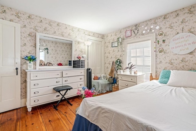 400 N Woodstock Rd, Southbridge, MA 01550 - bedroom featuring wood-type flooring and wallpapered walls