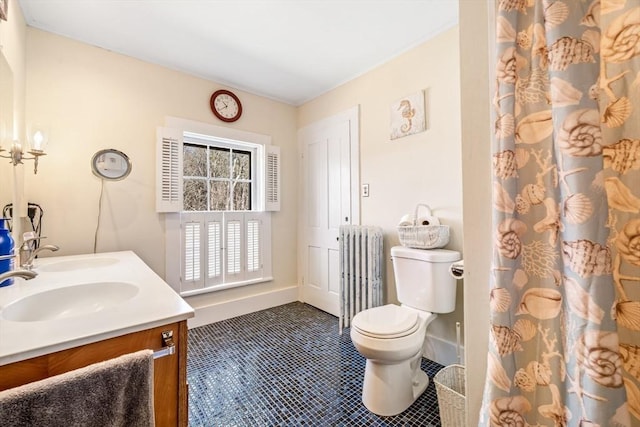 400 N Woodstock Rd, Southbridge, MA 01550 - bathroom featuring radiator heating unit, baseboards, a sink, and toilet