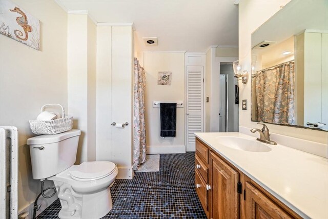 400 N Woodstock Rd, Southbridge, MA 01550 - full bath featuring toilet, tile patterned floors, radiator, and vanity