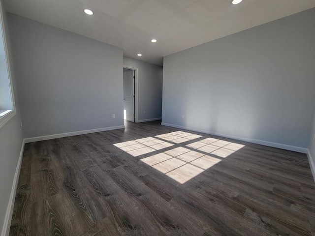 empty room with dark hardwood / wood-style floors