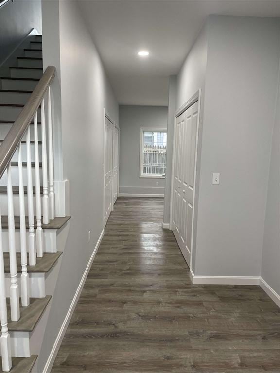 corridor with dark hardwood / wood-style floors