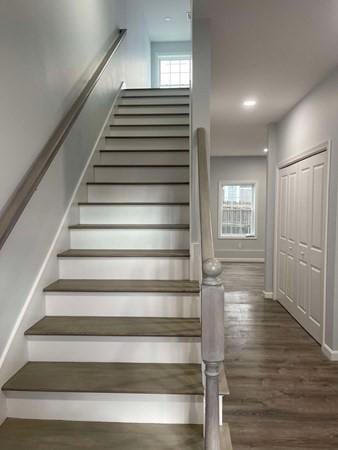 stairway featuring hardwood / wood-style floors