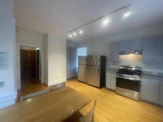 kitchen featuring appliances with stainless steel finishes and light wood-type flooring