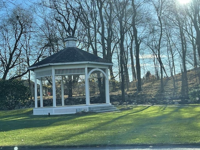 view of property's community with a gazebo and a lawn